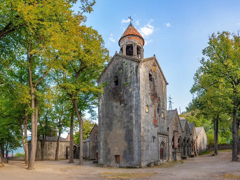 Best Things to Do in Alaverdi start at Sanahin Monastery under leafy trees.