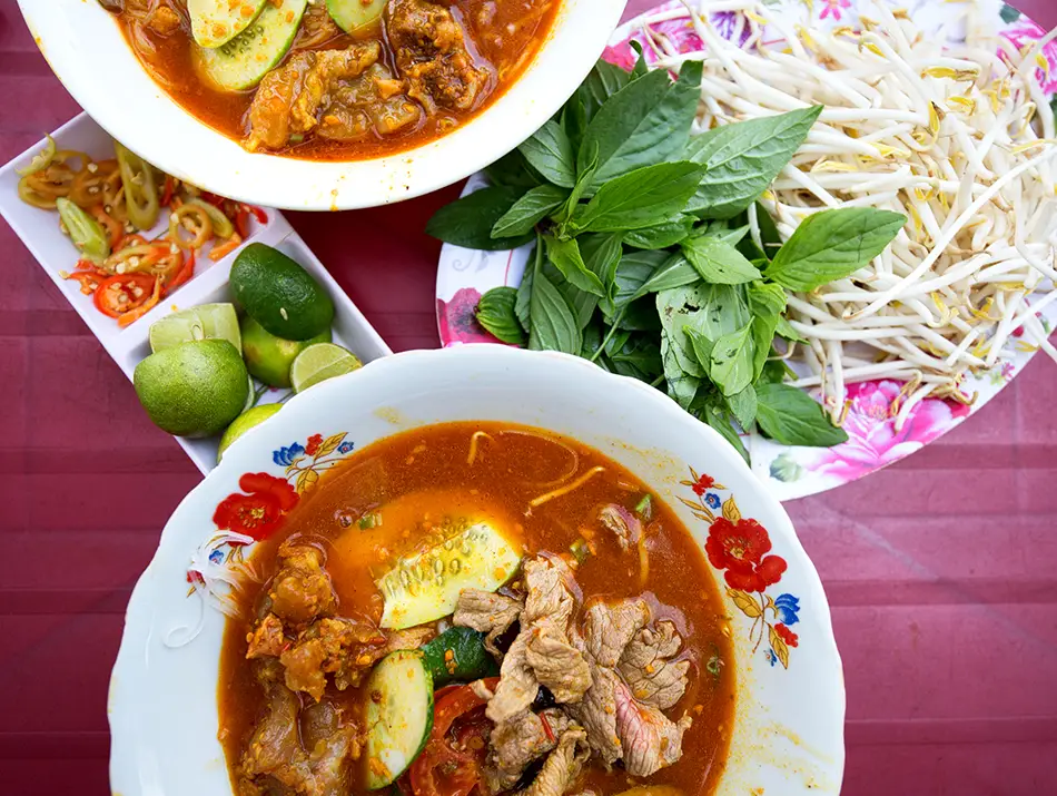 Hủ tiếu noodle soup with sliced pork, shrimp and quail eggs, a must-try food in Vietnam.