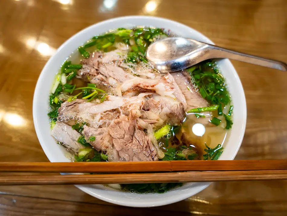 Aromatic broth with flat noodles and thin beef slices makes phở one of the best dishes in Vietnam.