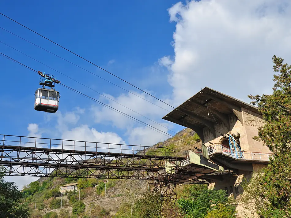 Top Attractions in Alaverdi include a vintage cable car crossing the valley.