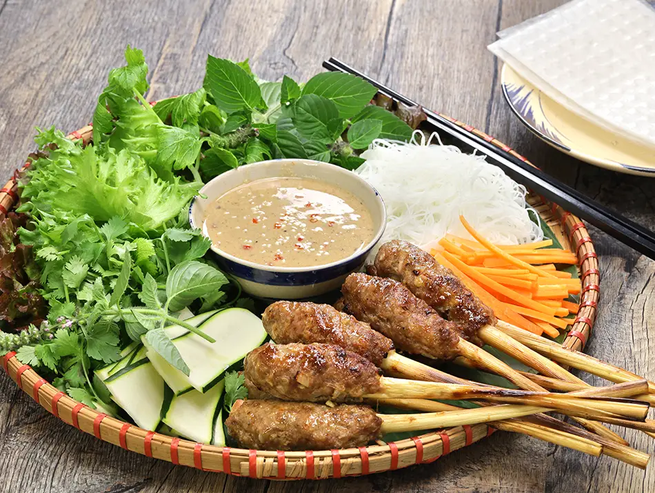 Lemongrass skewers with grilled pork paste, a typical Vietnamese food from central Vietnam.