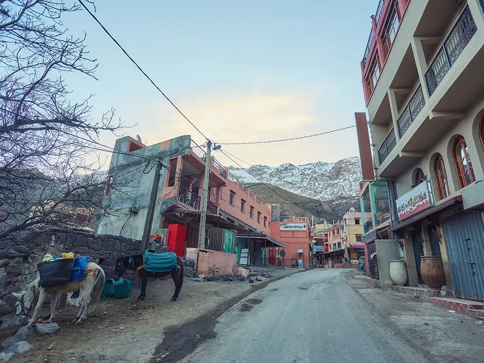Shops on main street, everyday activities in Imlil on display.