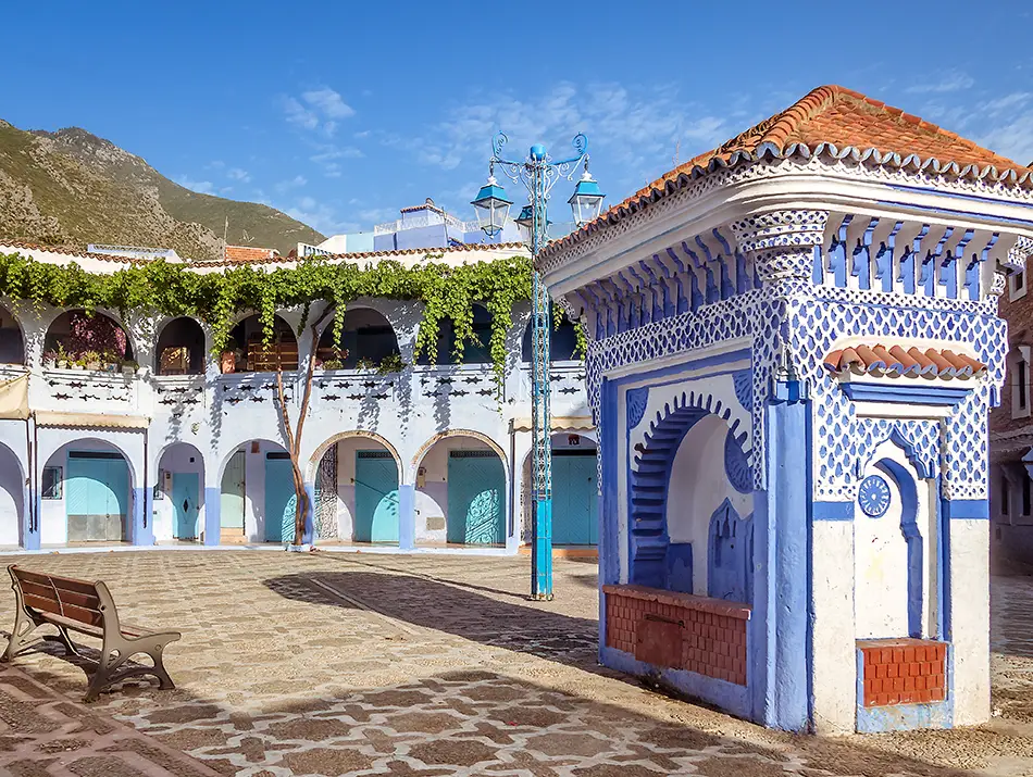 Plaza El Haouta with tiled fountain and blue facades