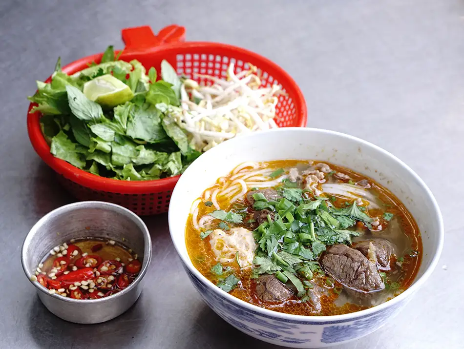 Spicy broth with beef shank and vermicelli noodles, a famous Vietnamese food from Huế.