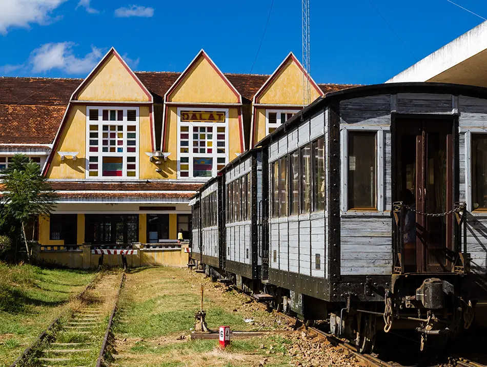 Historic Dalat Railway Station with yellow Art Deco design, one of the top attractions in Dalat.