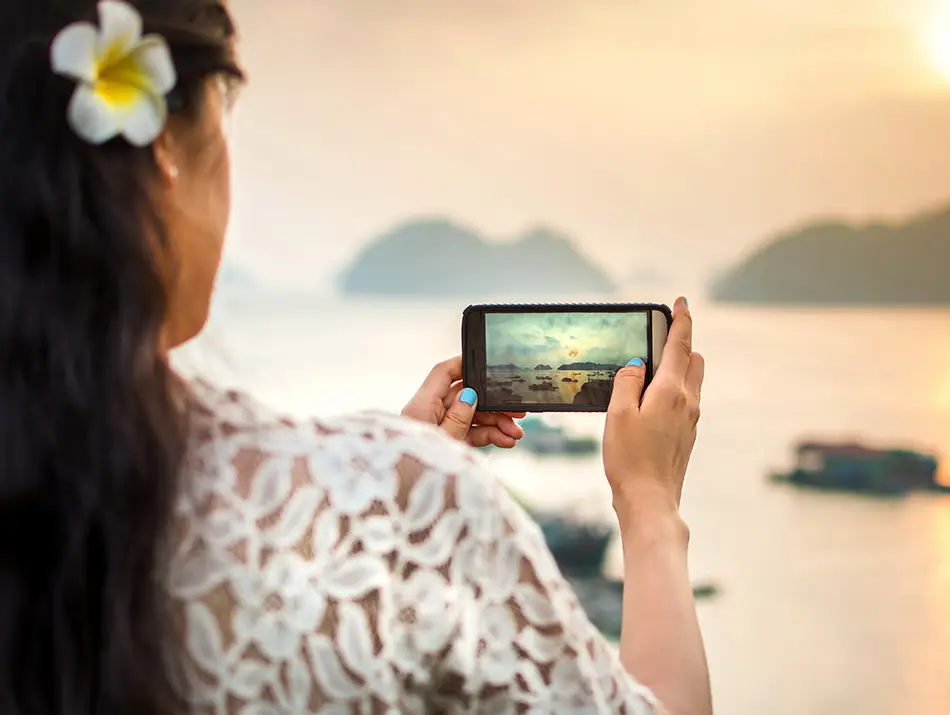 Tourist taking pictures of Lan Ha Bay