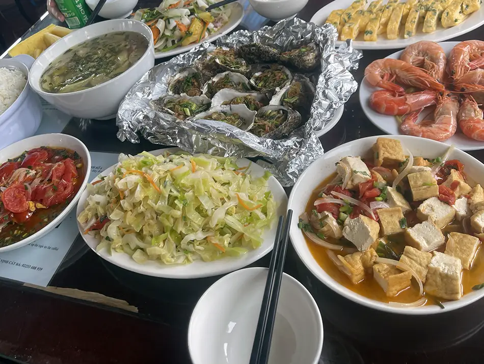 Seafood feast on a Lan Ha Bay cruise, often included in a Cat Ba itinerary.