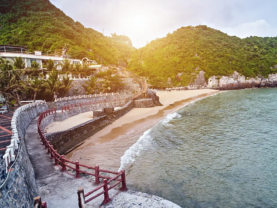 Visitors enjoying sandy Cat Co Beach, a popular attraction in Cat Ba Vietnam.