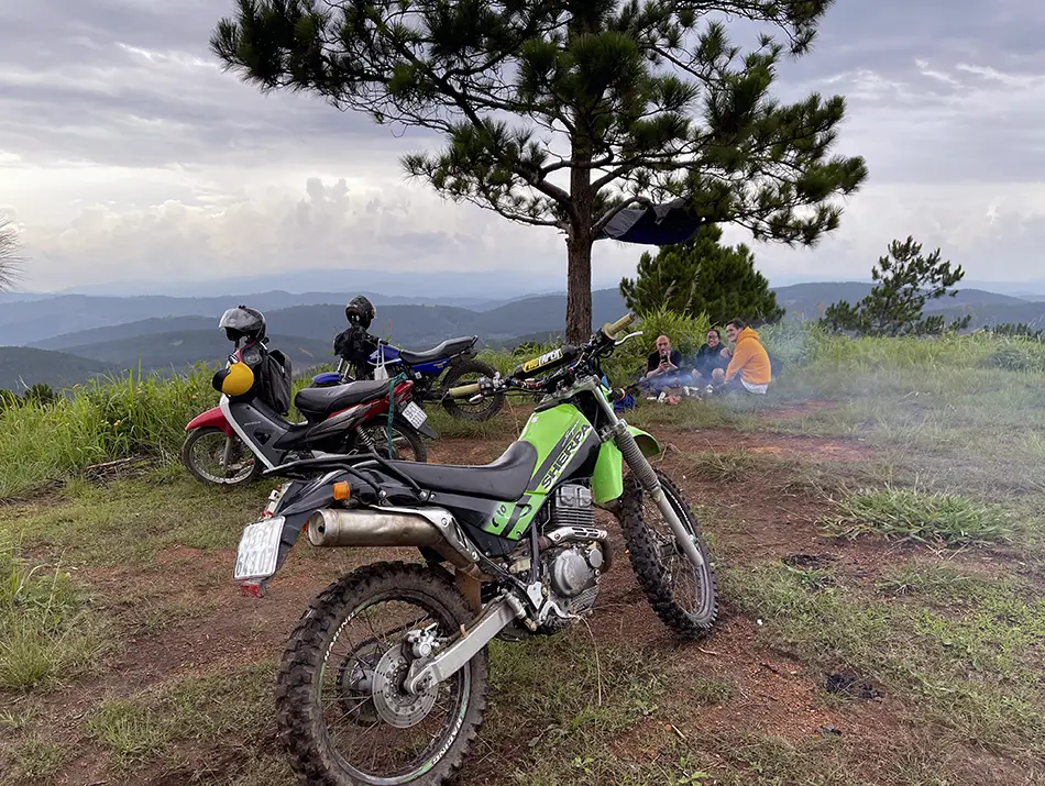 Enduro bikes parked at the viewpoint answering on how to get around dalat