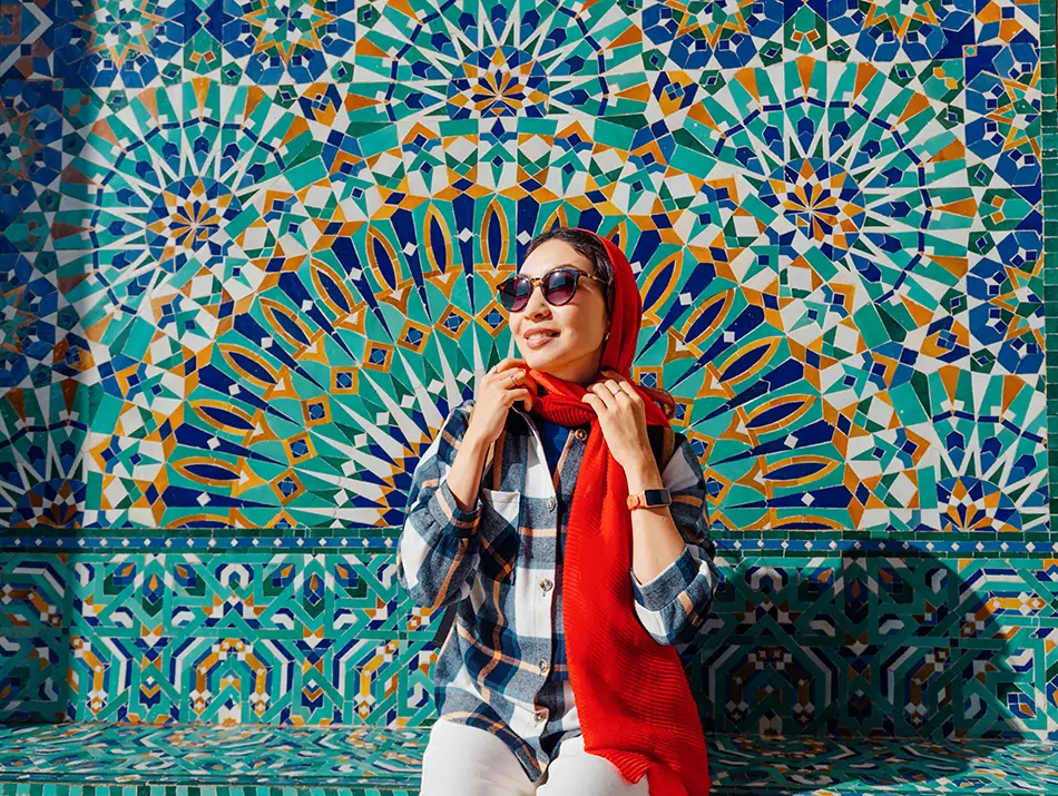 Tourist in Morocco wearing a headscarf and covered shoulders, highlighting the modest dress code in Morocco