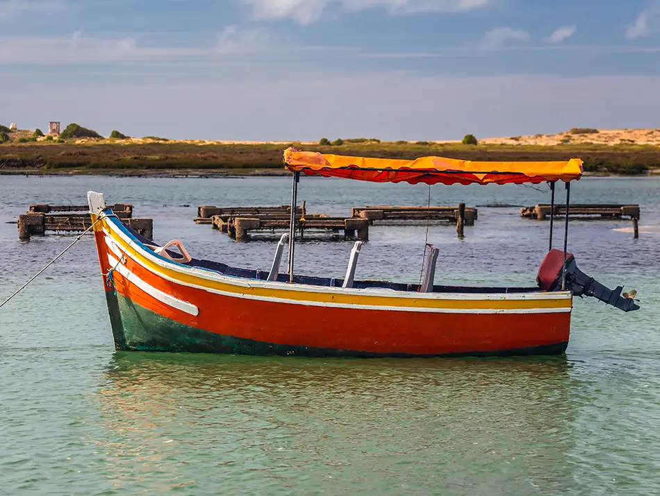 Fishing boat in the calm waters of the Oualidia Lagoon