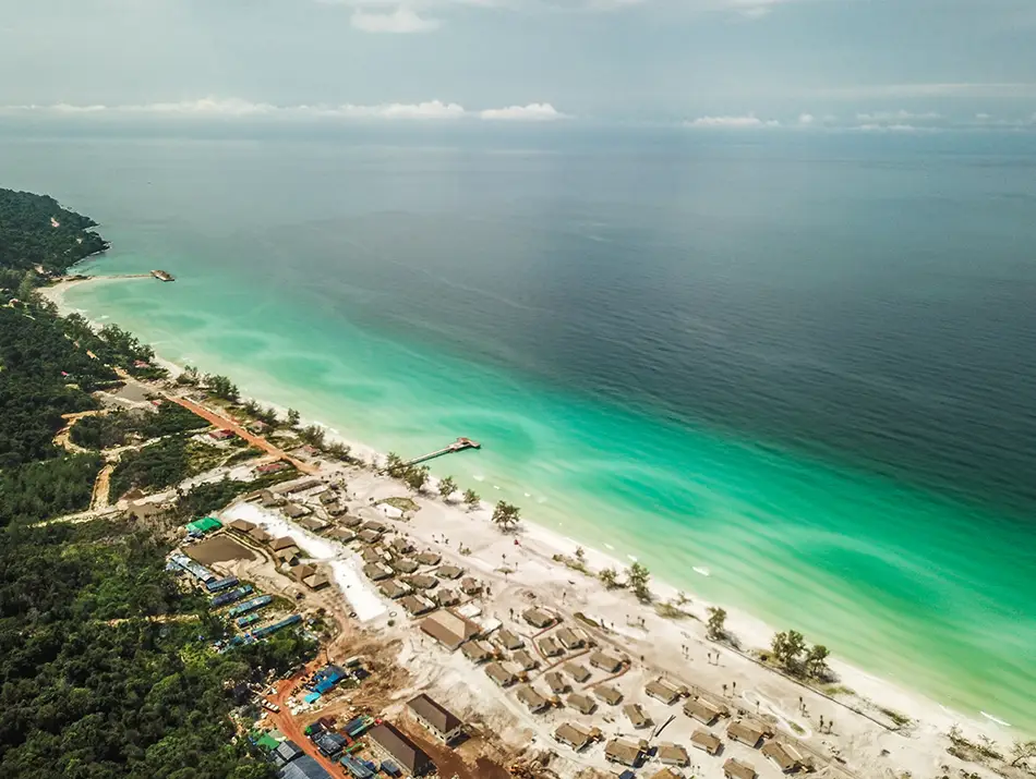 Aerial view of Koh Rong island’s long white beach, a top island destination in Cambodia.