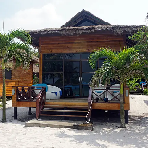 Small beachfront hotel surrounded by tropical plants on Koh Rong Samloem.