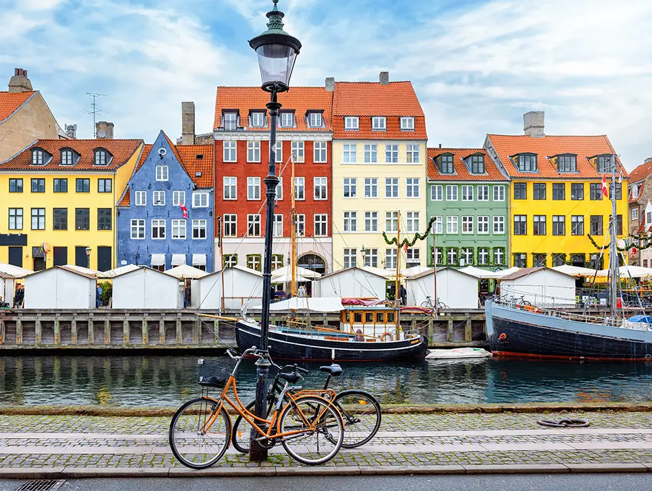 Colorful canal houses lining a historic quay in one of the best countries in the world to visit.