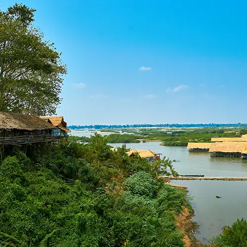 Panoramic view of the Mekong River flowing past green riverbanks