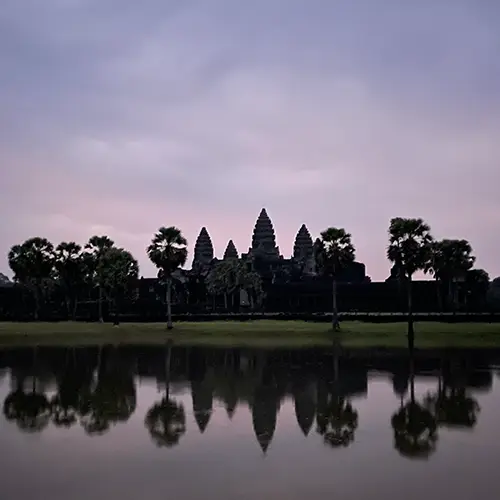 Angkor Wat reflecting in the lake at sunrise.