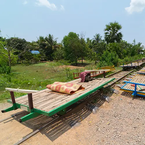 A bamboo platform sits on country tracks, one of the hidden gems in Cambodia.