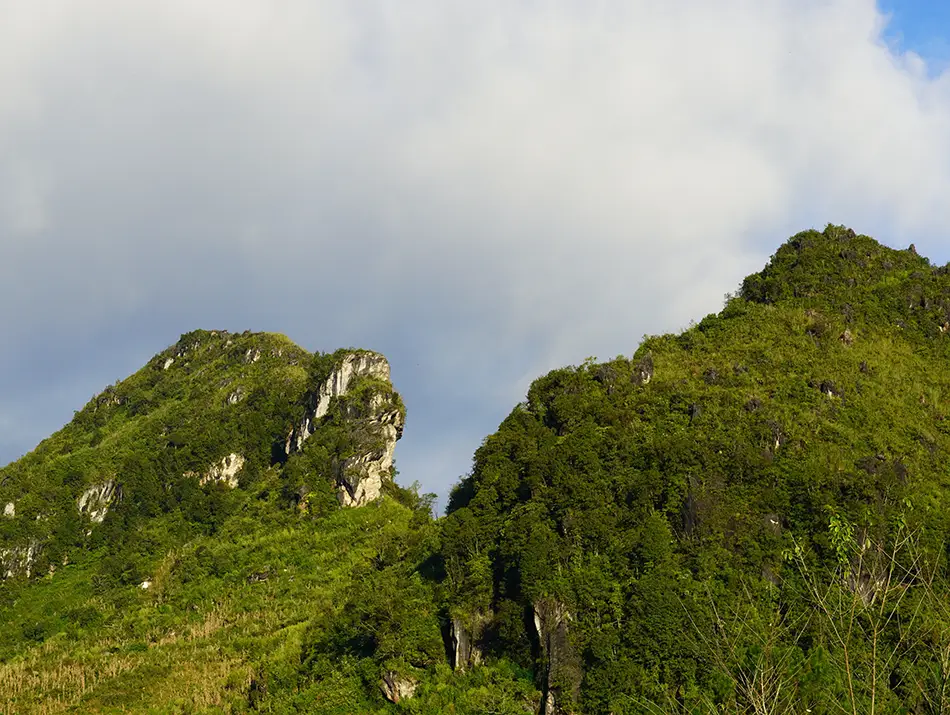 Jagged green peaks rise from Ham Rong Mountain, offering wide views across Sapa’s rolling highlands