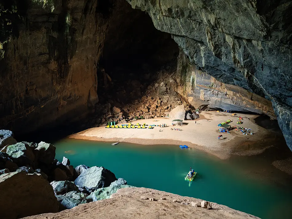 A sandy riverside beach inside En Cave forms one of the Must-see attractions in Phong Nha.