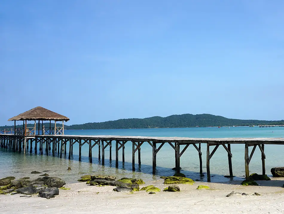 Long jetty stretching over turquoise waters, one of the best tourist places in Cambodia.