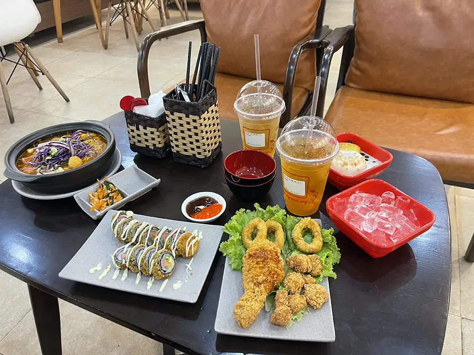 A table with Vietnamese junk food — the weakest part of the cuisine