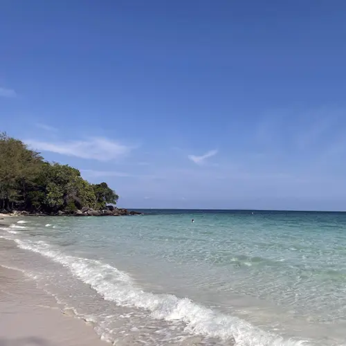 White sandy beach and turquoise water along Koh Rong’s tranquil shoreline.