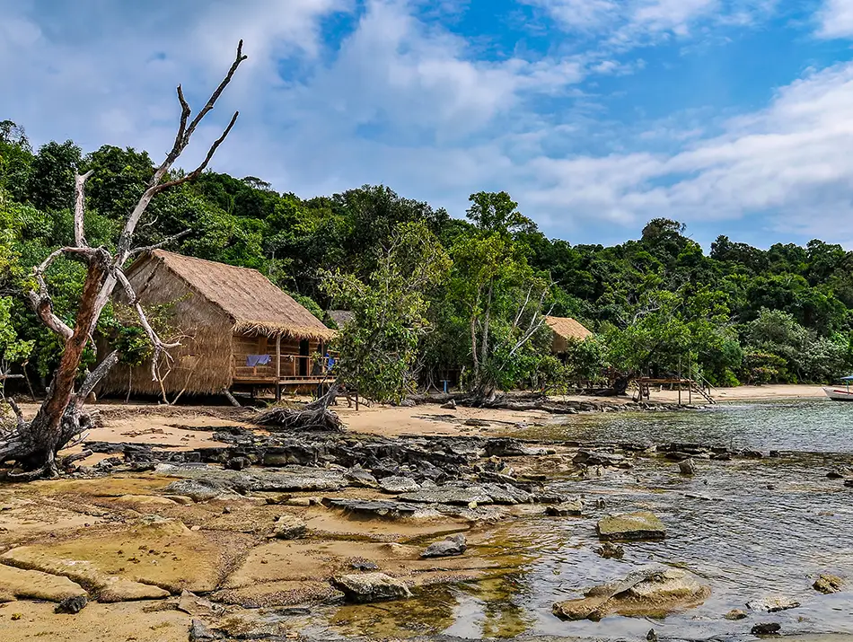 Rocky beach and rustic hut by the sea on Koh Ta Kiev bay.