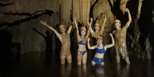 A group of tourists exploring best caves in vietnam