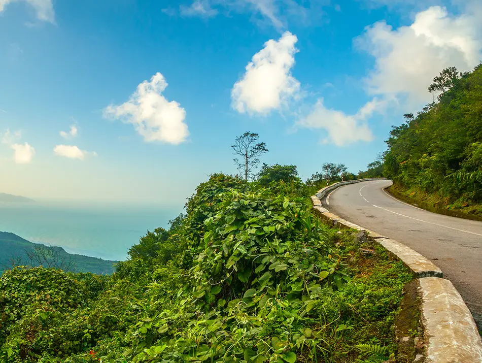 A winding coastal road along Hai Van Pass, a scenic drive considered one of the best things to do in Da Nang.