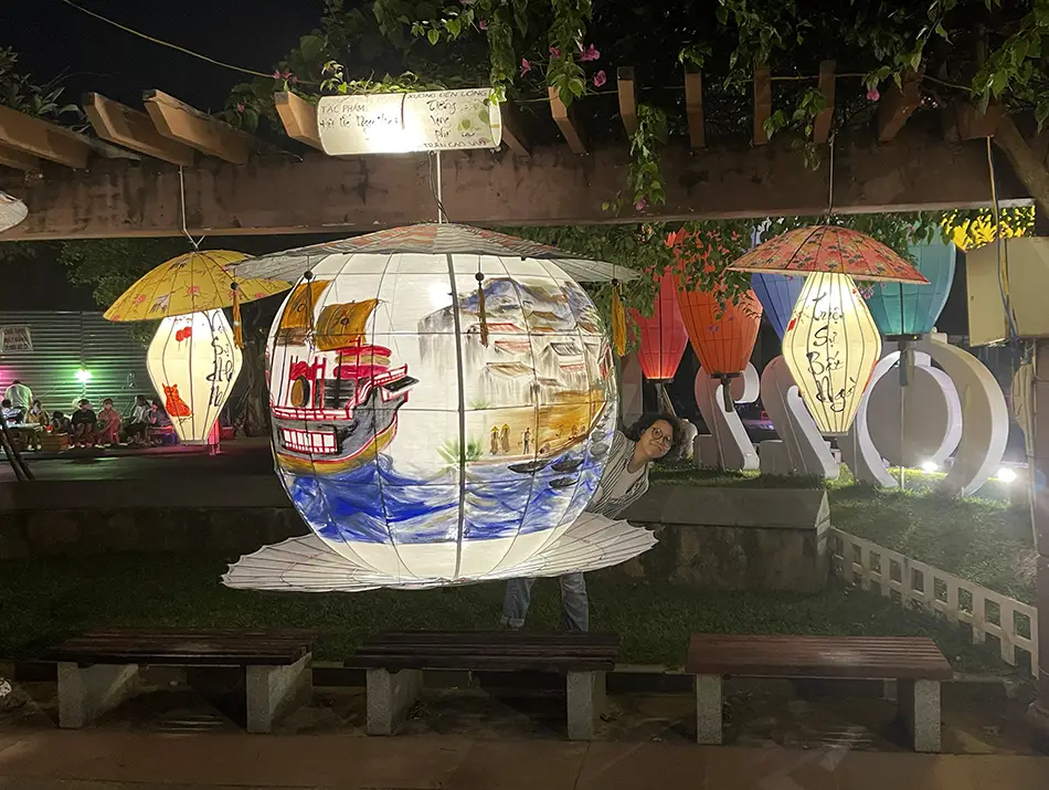 Rows of handmade silk lanterns fill the space with color and detailed craftsmanship.