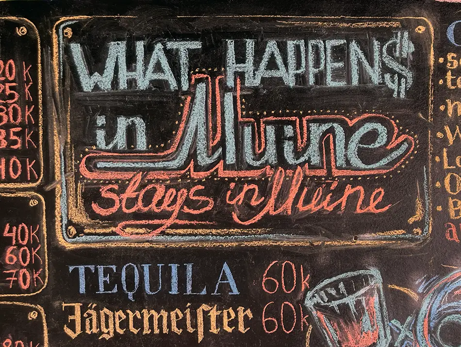 A bar sign saying “What happens in Mui Ne stays in Mui Ne.”