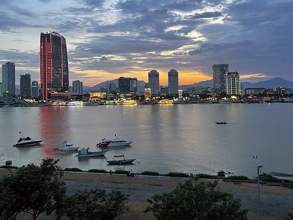 Sunset colors reflecting across the riverfront skyline