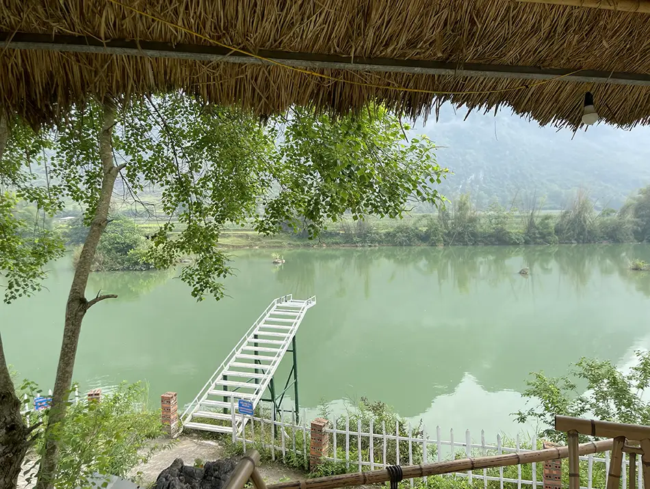 A river view from a hotel terrace, showing that observing nature slowly is one of the best things to do in Ban Gioc.