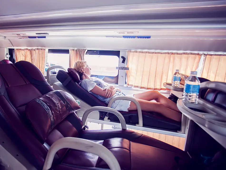 Reclining sleeper bus cabin scene showing how to get to Ninh Binh overnight.