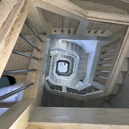 Narrow spiral staircase climbing inside the towering Jesus Christ monument.