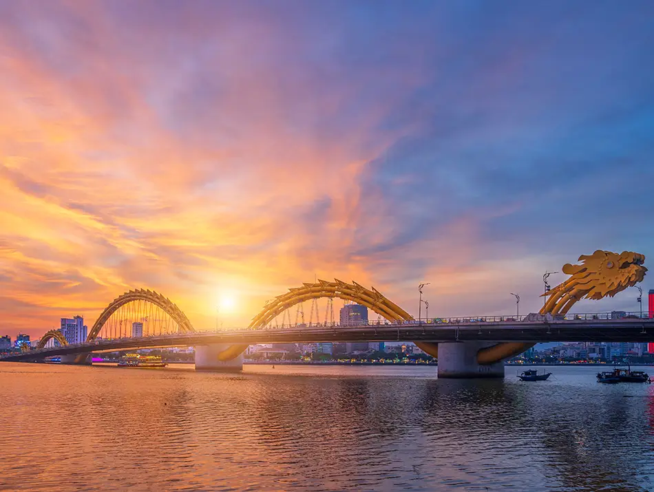 Golden sunset behind Dragon Bridge highlights one of the top attractions in Da Nang.