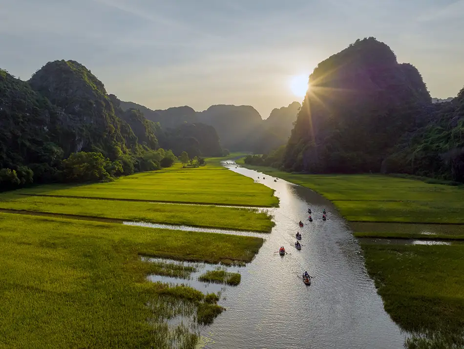 Boat journey through rice paddies, one of the best things to do in Ninh Binh.