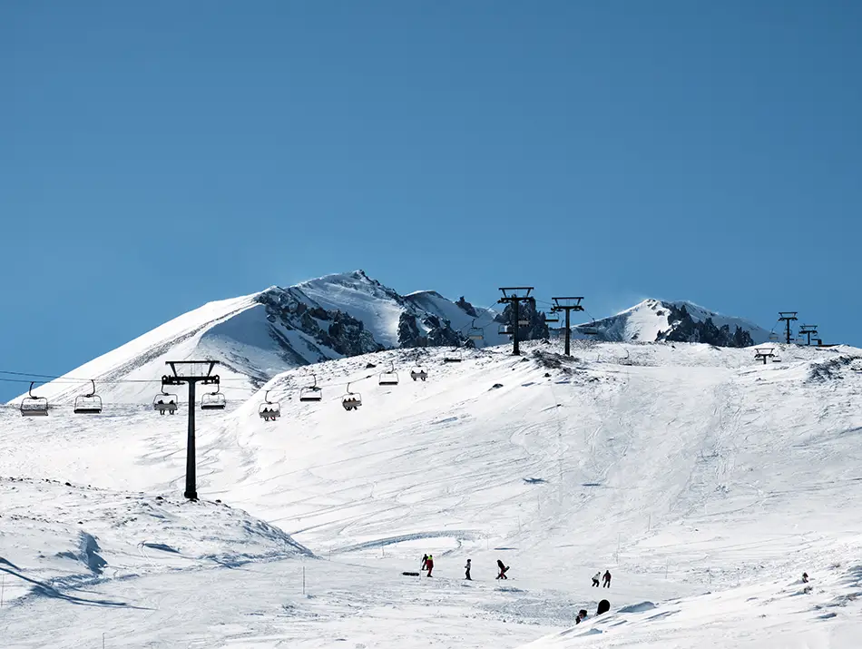 Wide alpine piste and lift towers at Erciyes, one of the underrated ski resorts.