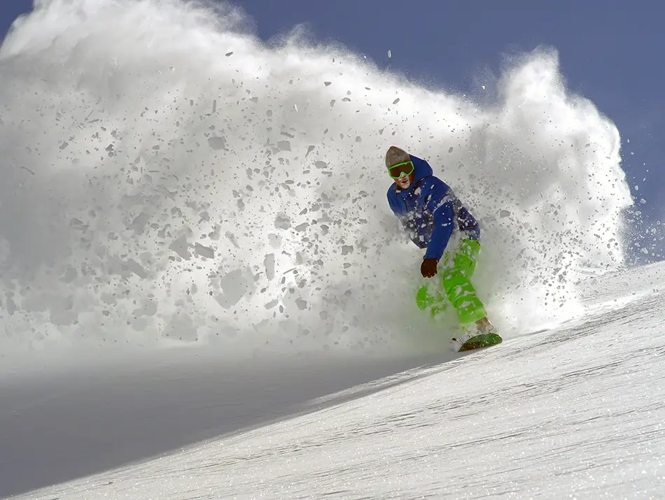 Skier blasts through Oukaïmeden powder, proving underrated ski resorts can deliver deep turns.