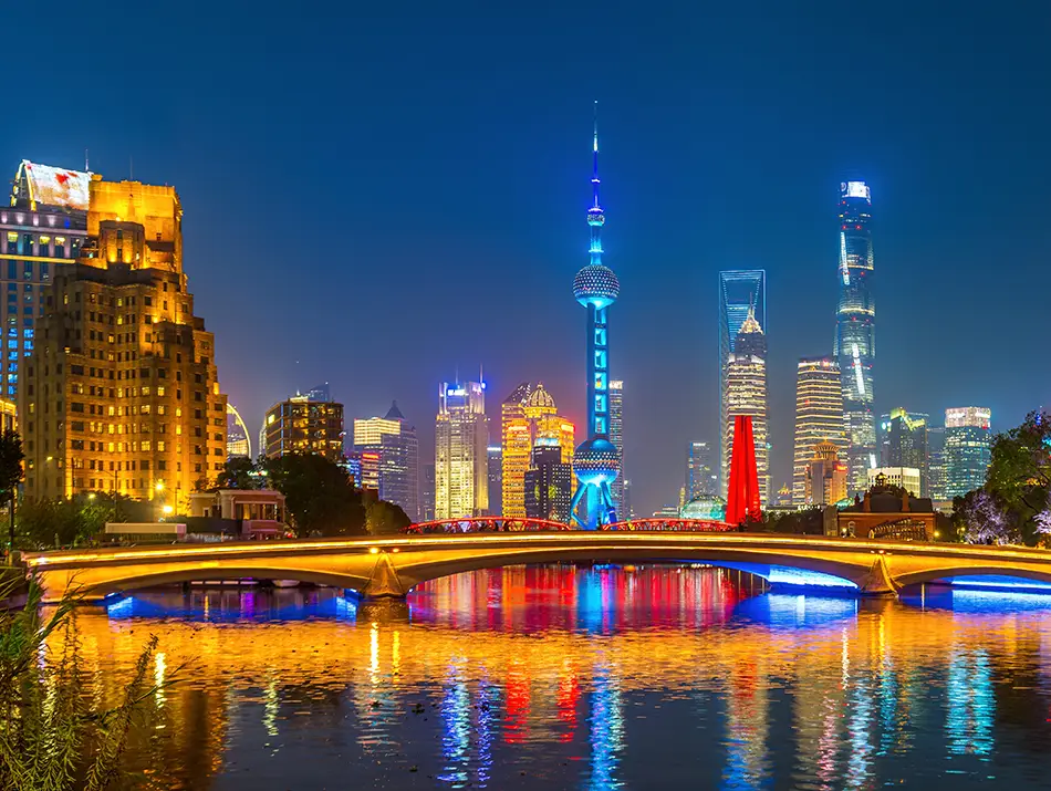 Night skyline across the river in Shanghai, one of the trending shopping destinations for 2026.