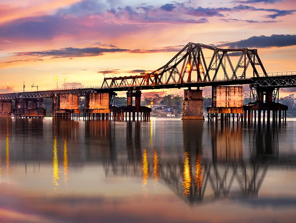 Long Bien Bridge glows at twilight, often listed among best sunset spot in Hanoi.