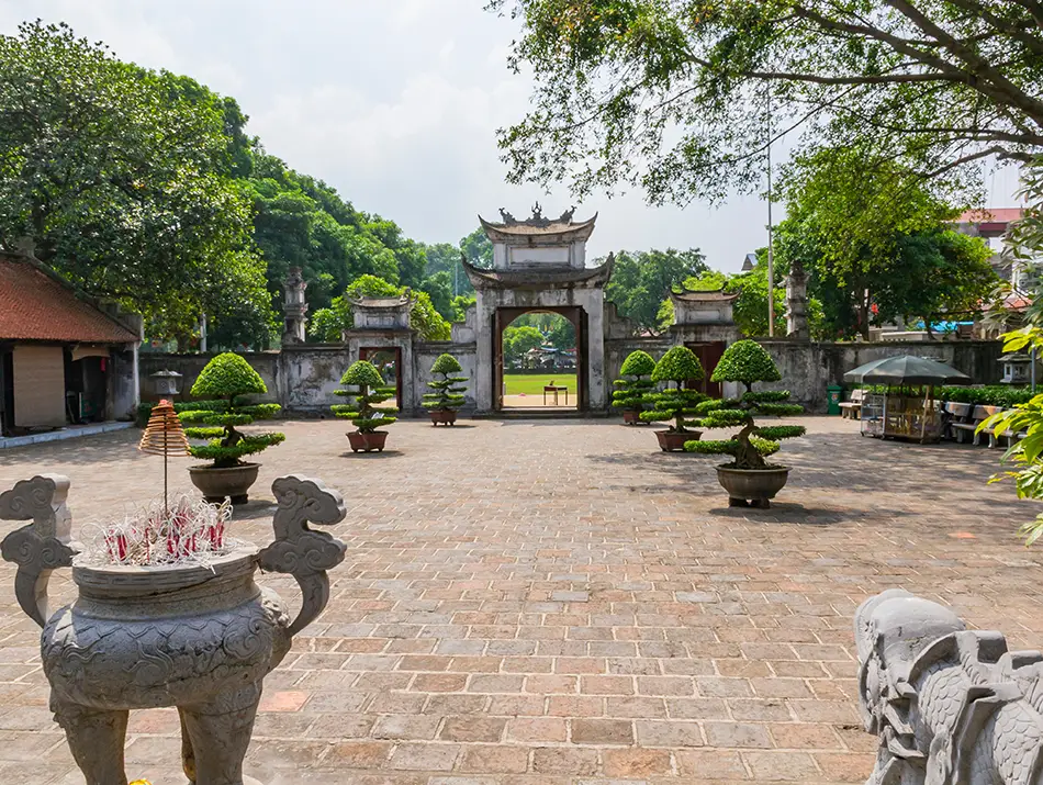 Open stone courtyard with altars and gates, part of the best things to do in hanoi for history.