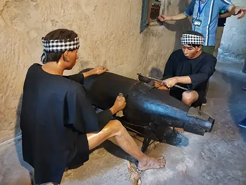 Demonstration shows how unexploded ordnance was dismantled to extract explosives during wartime operations.