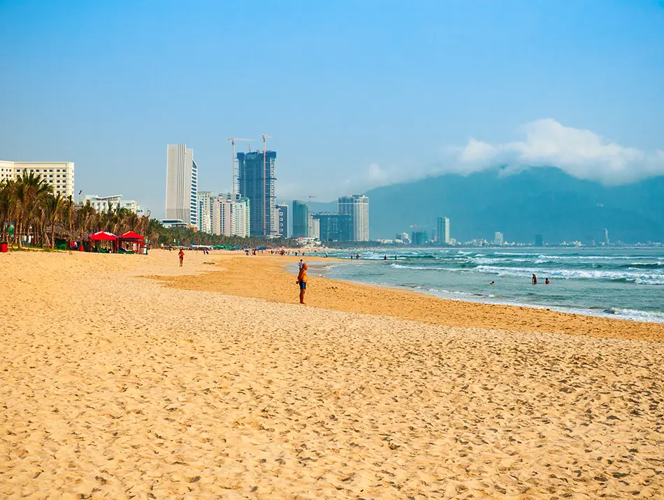 Sandy My Khe Beach in Da Nang lined with hotels, hosting best surfing in Vietnam