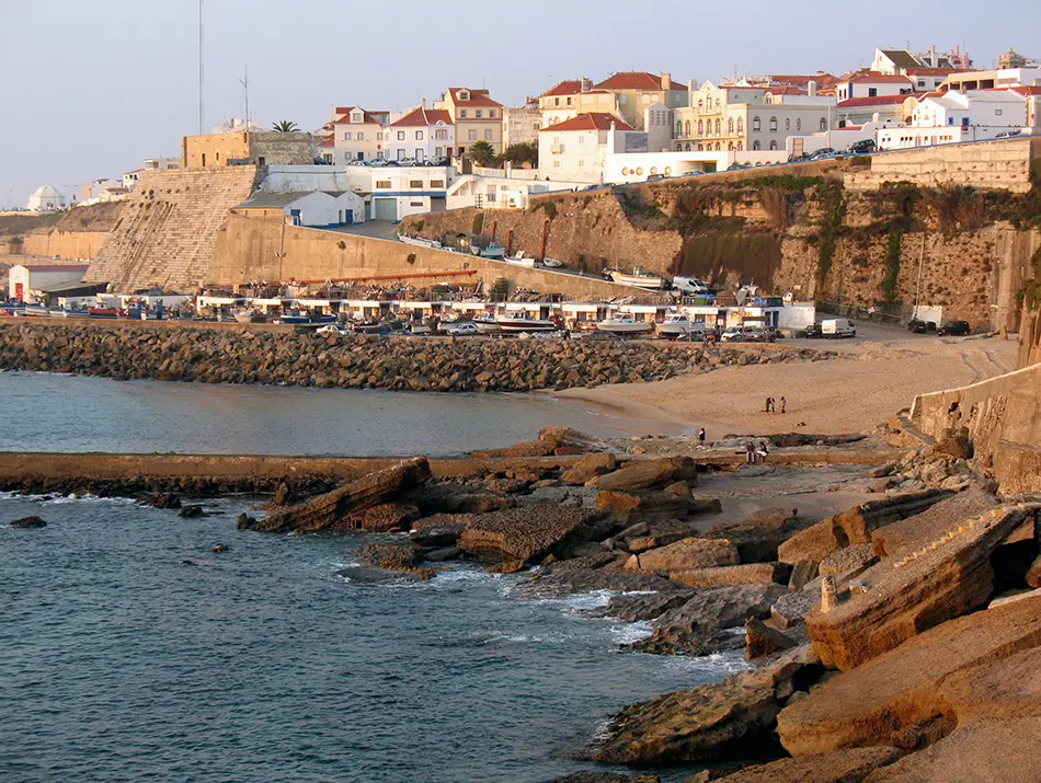 Whitewashed houses and cliffs overlooking the Atlantic Ocean in Ericeira, Portugal.