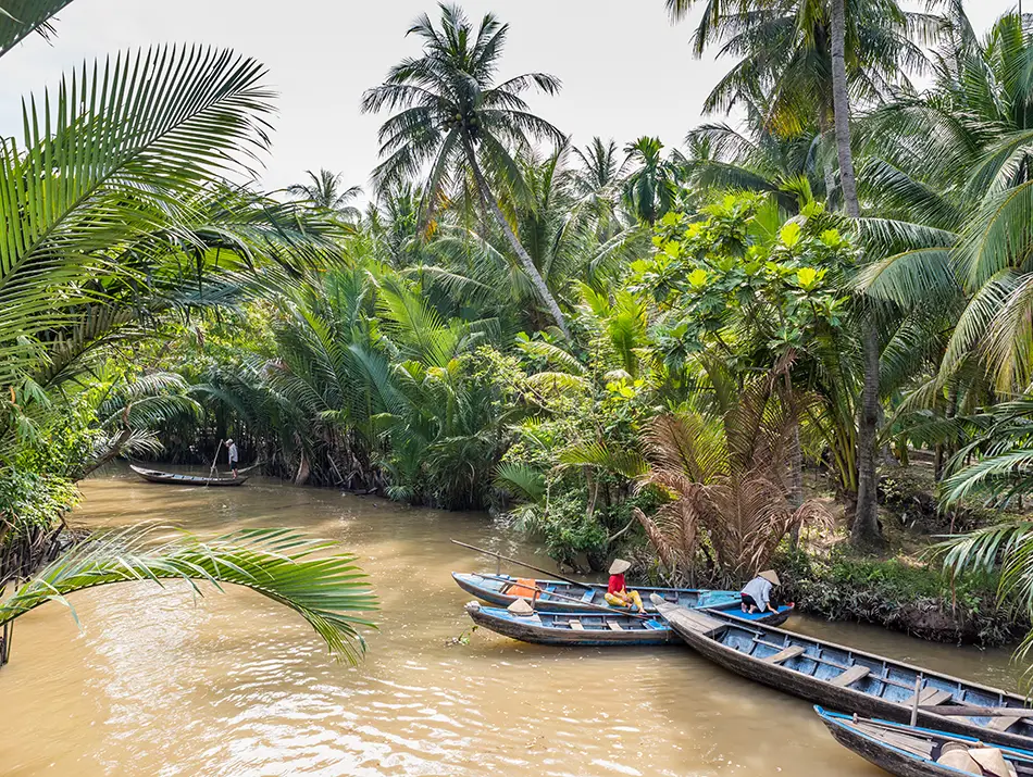 Palm-lined canal boat ride in Mekong Delta, one of the best day trips from HCMC
