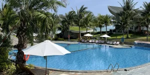 Relaxing by a beachfront resort pool, one of the best things to do in Mui Ne.