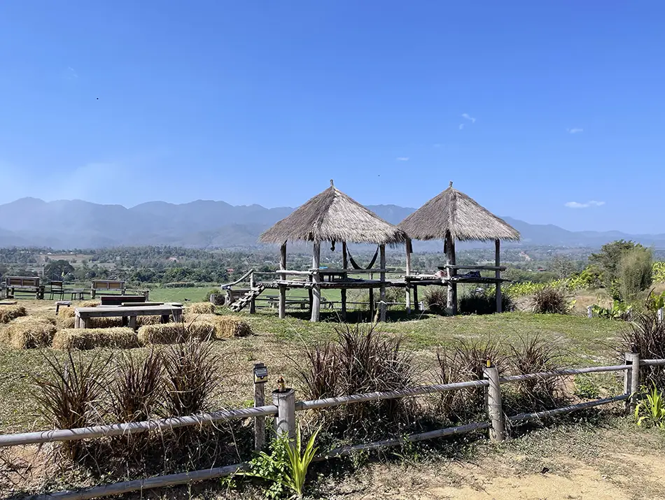 Wide view of Pai valley with mountains and rural landscape in northern Thailand.