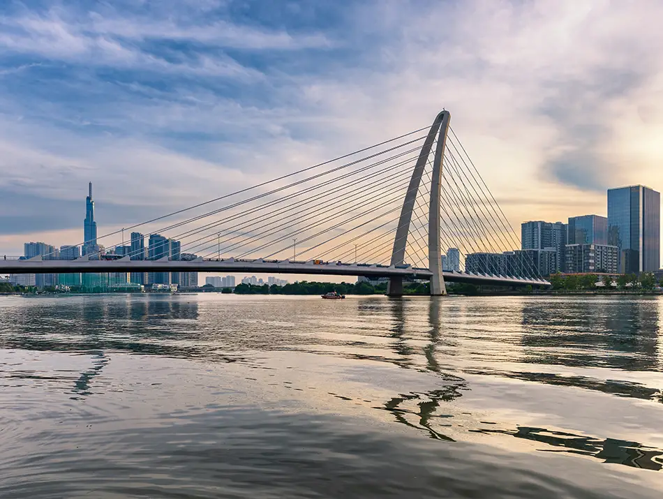 Calm river view along the city skyline, highlighting the water bus ride as one of the Best Things to Do in Ho Chi Minh.