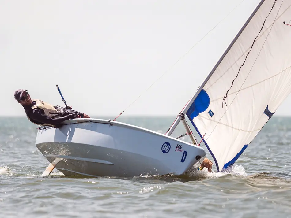 Solo sailor leaning out on a dinghy in Mui Ne.